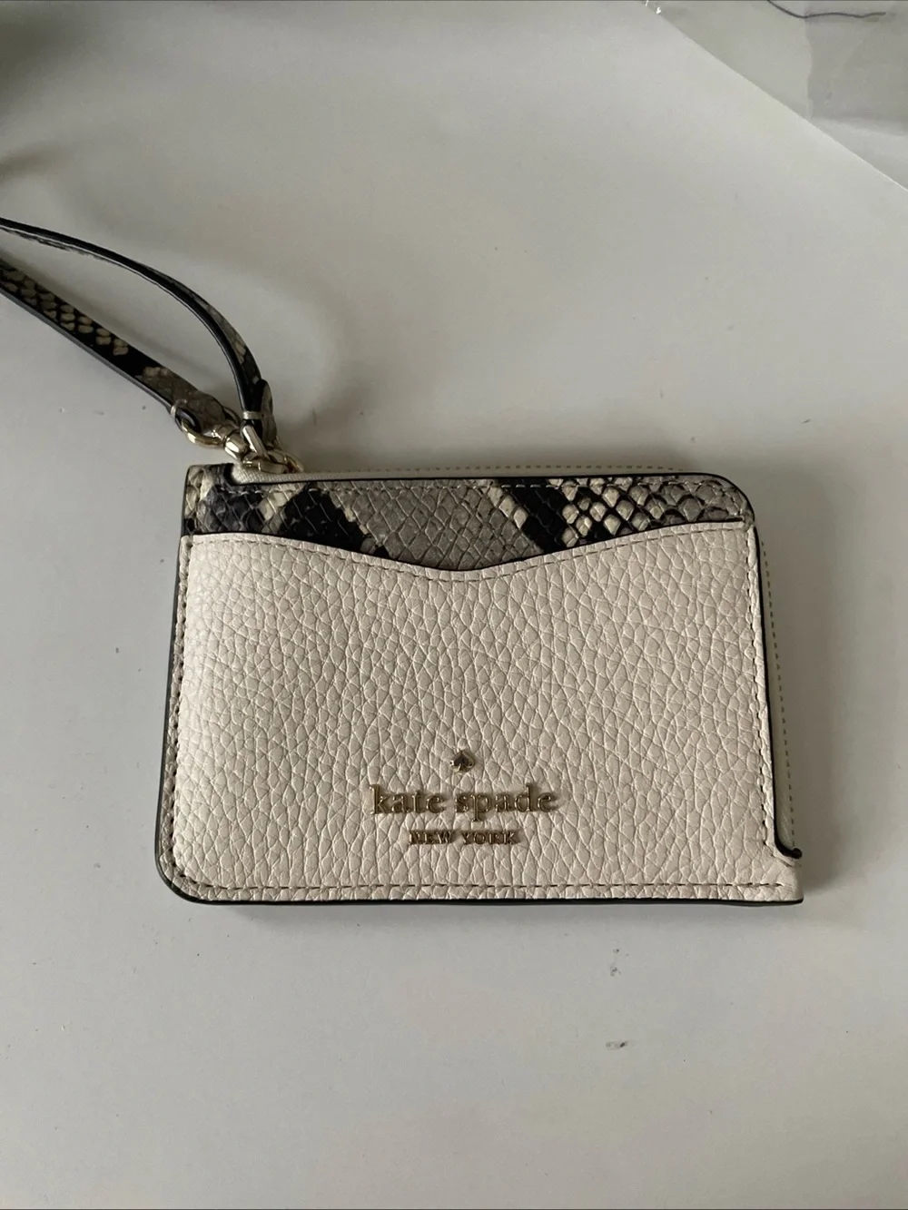 kate spade Cream Pebbled Wristlet with Snake-Print Trim